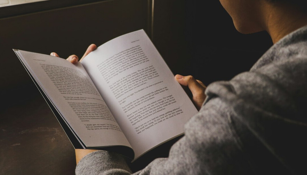 woman reading mystery novel